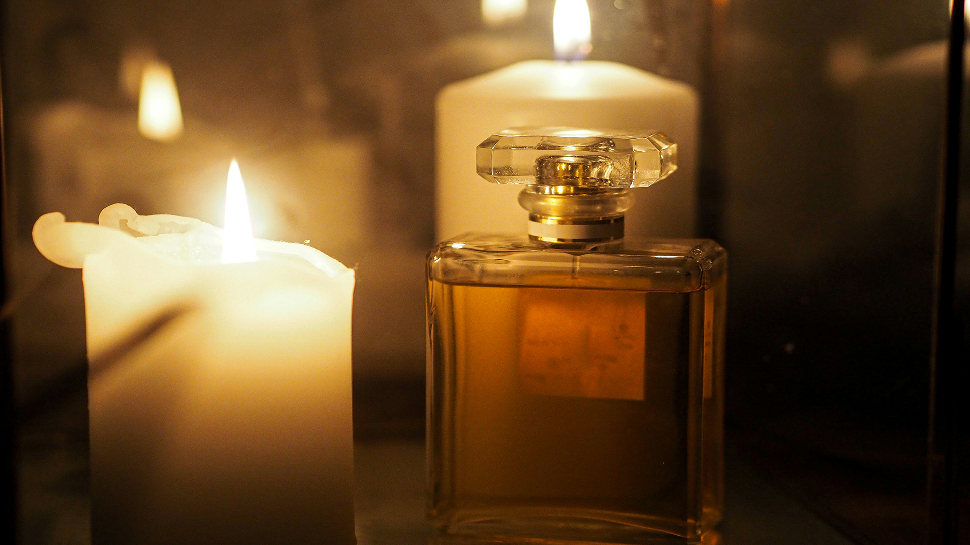 Perfume and Candles on a table